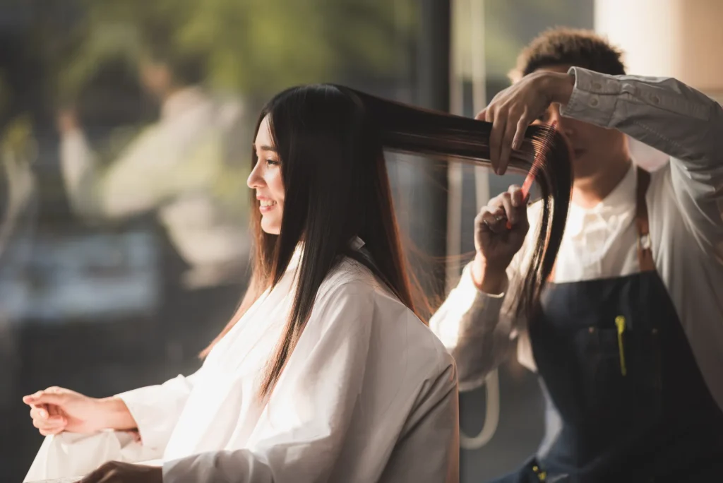 woman having hair styled in salon by hairdresser 2026 03 24 22 18 40 utc