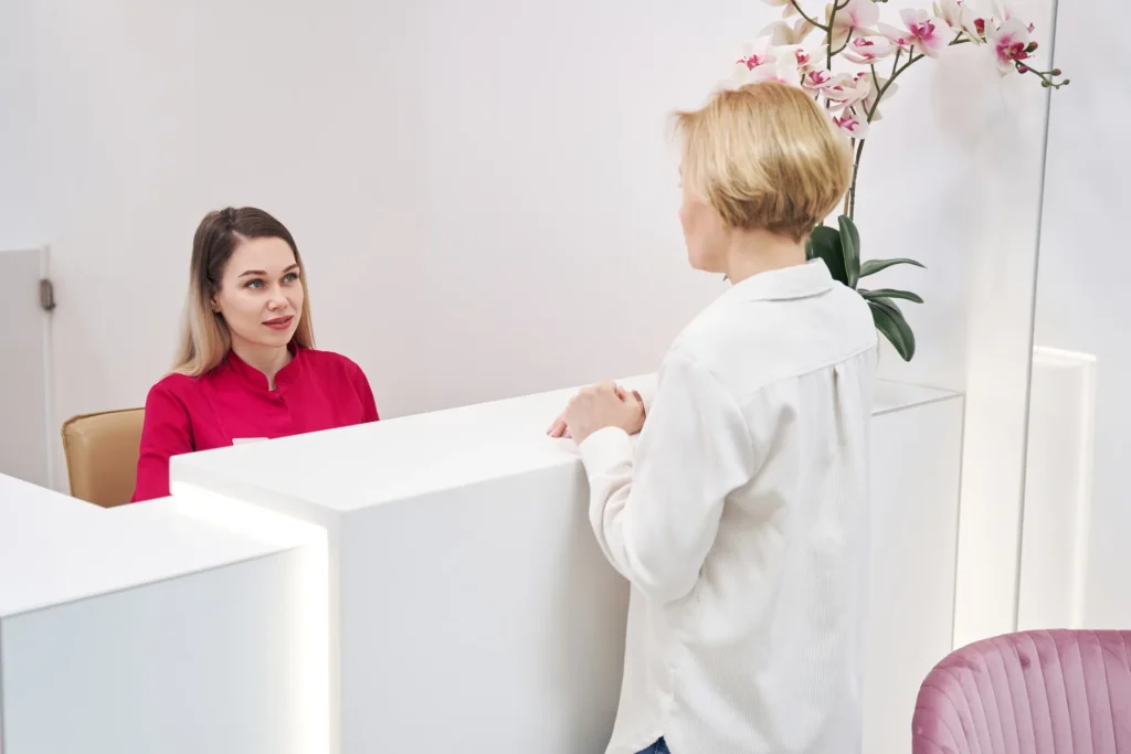 woman at reception talking with the employee 2026 09 23 19 22 57 utc